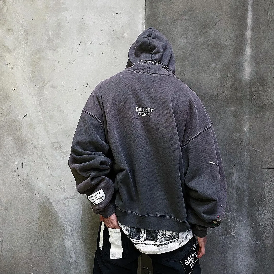 GALLERY DEPT. 90'S RECYCLE HOODIE WASHED BLACK 90'S washed hoodie with distressed eco-friendly slogans. Washed black S-XL. Ready-made garments are washed and dyed again. Multiple spots throughout the body are spray-faded. The ribs are cut and worn.